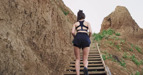 A Girl Wearing Black Sports Wear , Stays Healthy