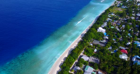 Beautiful above clean view of a sunshine white sandy paradise beach and aqua blue water background 