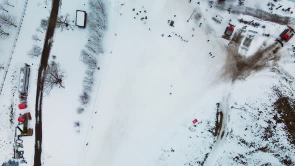 Suburb of a big city. City block from the height of the flight. City slide for skiing.