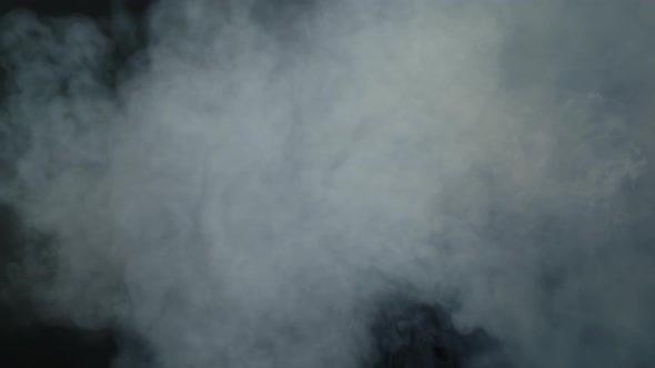 Smoke From Above Against Black Background