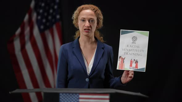 American Politician Woman Activist Holding Racial Sensitivity Training Sign Talking Looking at
