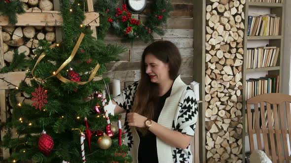 Beautiful Woman Decorate Christmas Tree
