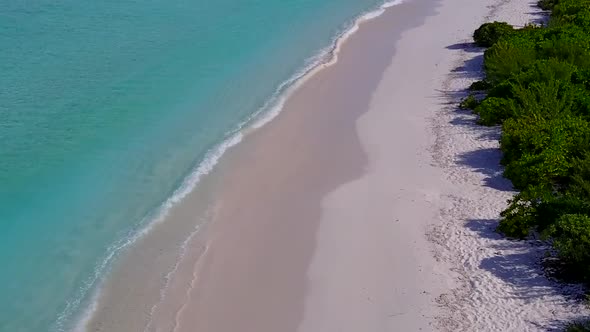 Drone scenery of marine island beach time by blue water with sand background