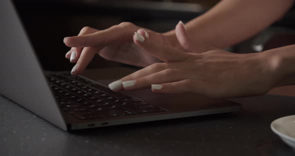 Close Up Shot of an Young Woman's Hands Working on Laptop