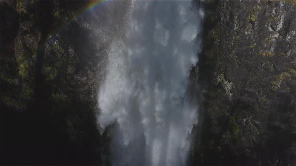 Waterfall Rushing Down a Rocky Canyon in the Canadian Mountains