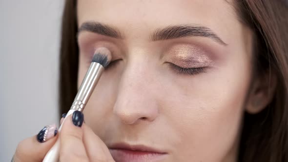 Cropped View of Girl's Face in Process of Doing Makeup