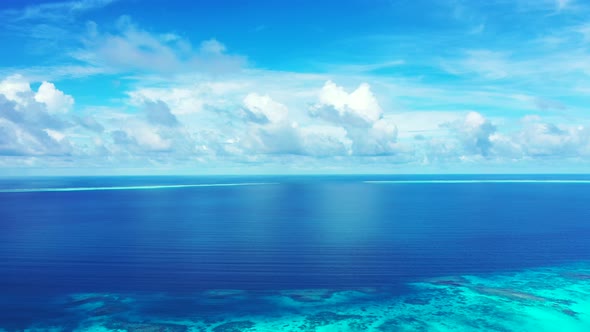 Natural birds eye clean view of a paradise sunny white sand beach and blue ocean background in vibra