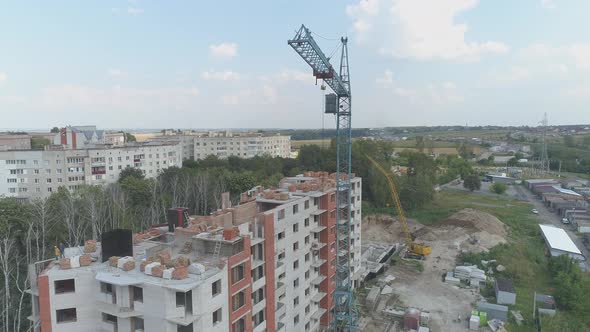 Aerial of a crane and a building under construction