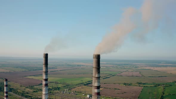 Aerial Drone View of High Chimney Two Pipes with Grey Smoke From Coal Power Plant. Close Up V3