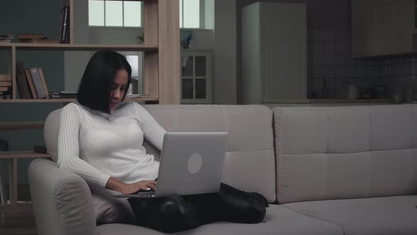 African american young girl student freelancer using laptop device 