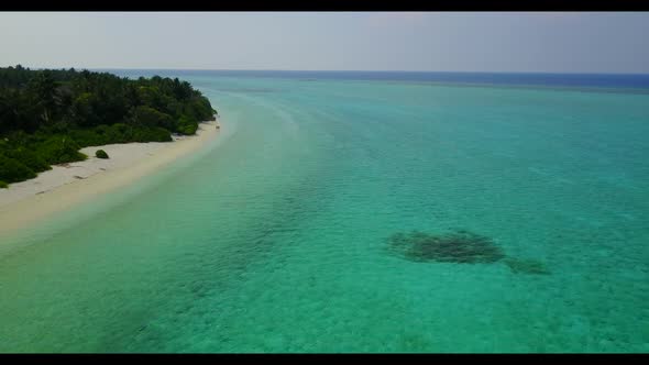 Aerial drone scenery of tranquil lagoon beach lifestyle by transparent sea and white sandy backgroun