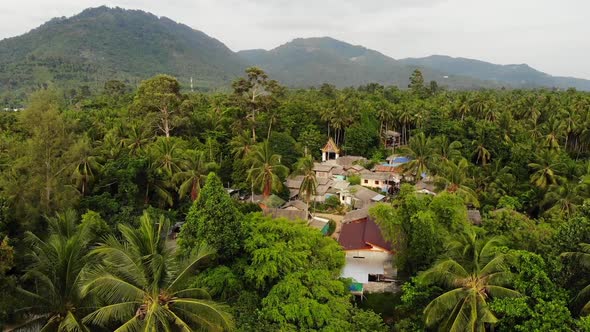 Classic Buddhist Temple Between Forest. From Above Drone View Buddhist Monastery Between Green Trees