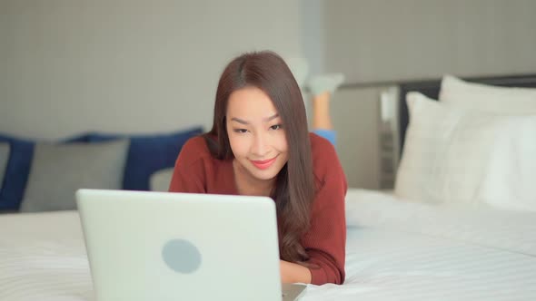 Young asian woman use laptop