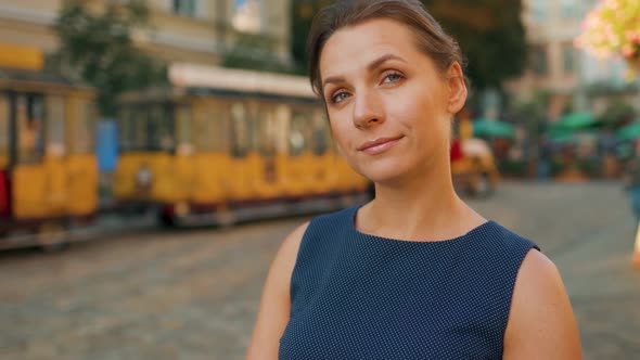 Portrait of a Woman with Standing in the Middle of a City Square