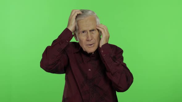 Senior Man Suffer By Headache Pain Trouble. Handsome Old Man on Chroma Key