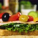 Delicious fresh sandwich preparation with cucumber, olives, ham, tomatoes and green lettuce - VideoHive Item for Sale