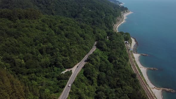 Aerial View From Drone of Curve Road with a Car on the Mountain with Green Forest in Russia