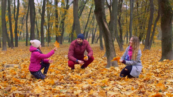 Positive Family with Girl Enjoying Fall Season