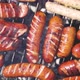 Brats Being Cooked on a Grill with Flame and Smoke - VideoHive Item for Sale