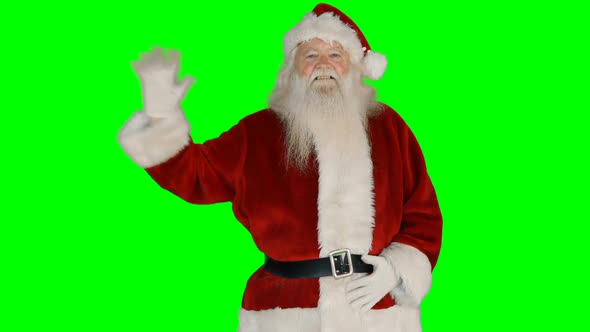 Portrait of happy santa claus waving hand