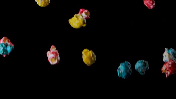 Multicolored Popcorn Flying Isolated on Black Background