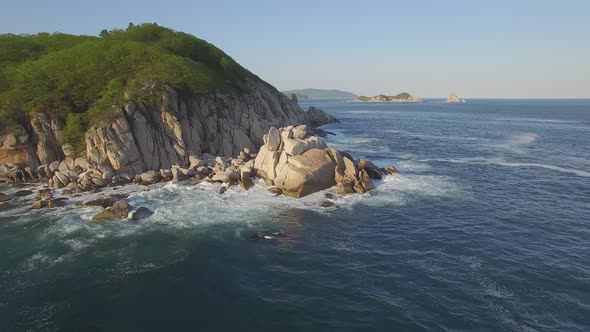 View From a Droneon a Stone Cape Washed By Strong Waves