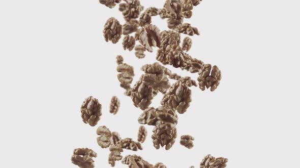 Falling of Walnuts in White Background