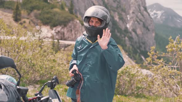 Happy Young Woman Photographer Walks in the Dolomites Mountains