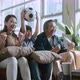 Asian parents And Son Watching Sports On TV Cheering Favorite Soccer Team - VideoHive Item for Sale