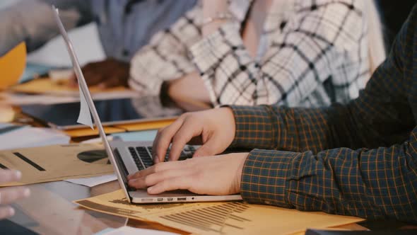 Close-up Shot of Male Software Developer Hands Working Behind Office Table with Laptop at Hackathon