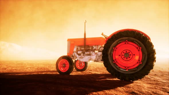 Vintage Retro Tractor on a Farm in Desert