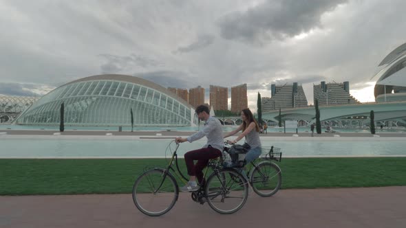 A couple riding bicycles along the modern Valencia view