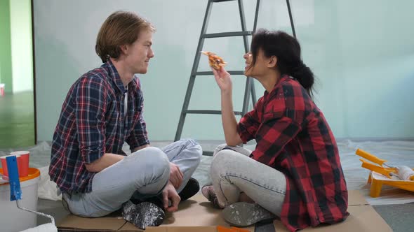 Cute Diy Couple Sharing Pizza During Home Makeover