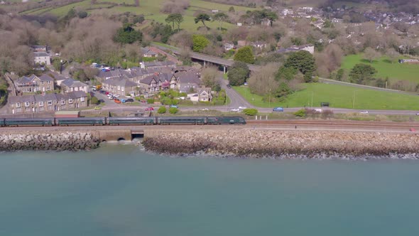 Commuter Train Alongside the Sea Aerial View