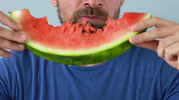 Bearded Man Eats a Juicy Watermelon