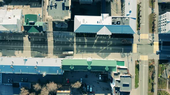 Transport Is Moving Along the City Driveway in a Top View