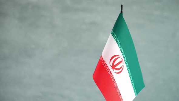 State Flag of Islamic Republic of Iran Waving on Light Background