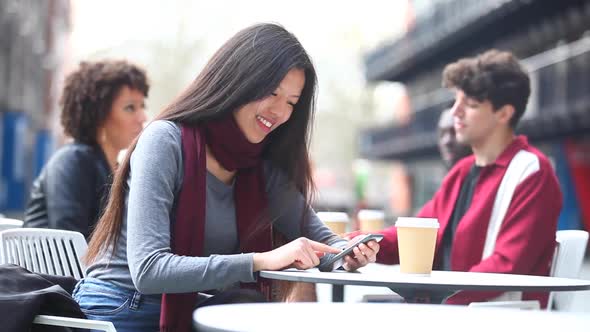 Authentic shot of people in a cafe, meeting, talking and using phones