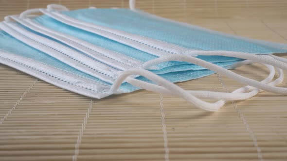 New medical protective hygiene masks on a bamboo mat