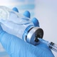 A Doctor or Nurse in Blue Medical Gloves Dials Medicine Into a Syringe - VideoHive Item for Sale