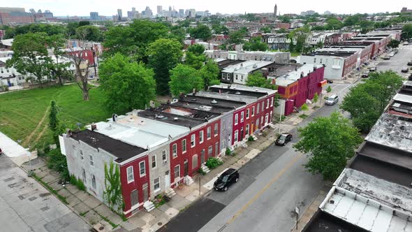 Poverty in America. Inner city homes in disrepair. Urban city skyline skyscrapers in distance on sum