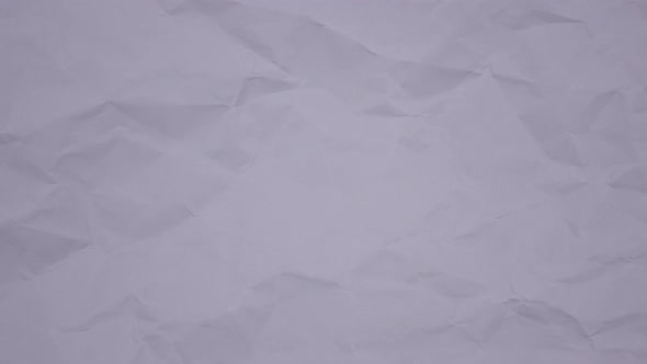 Crumpled wrinkled sheet of paper background texture. Stop motion animation. Seamless looping.