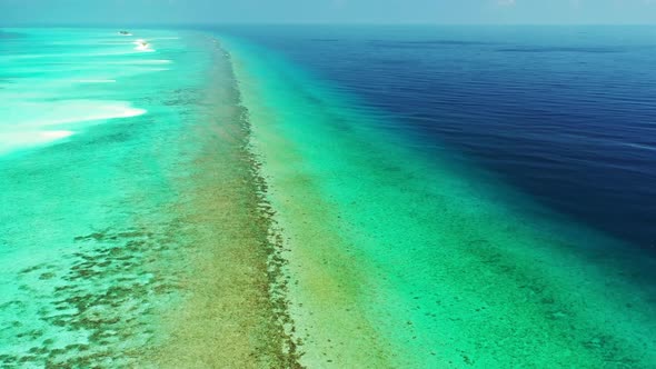 Aerial flying over texture of tropical coast beach time by blue lagoon and white sand background of 