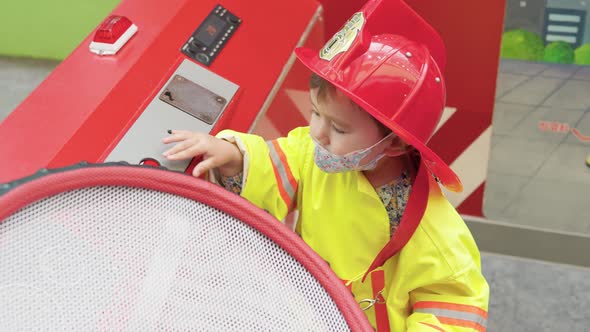 Little Girl In A Firefighter Uniform In Gyeonggi Children's Museum, South Korea - medium shot