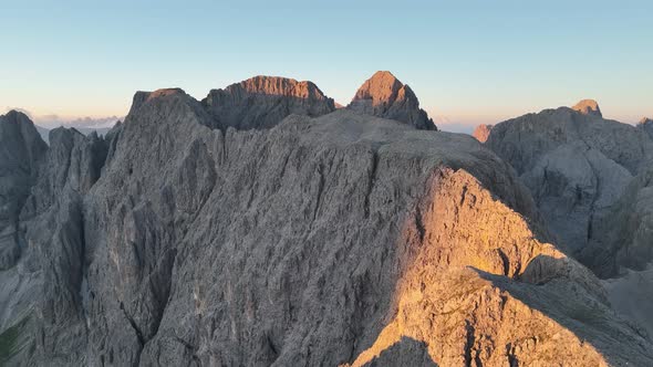 Dolomites mountains peaks on a summer sunrise