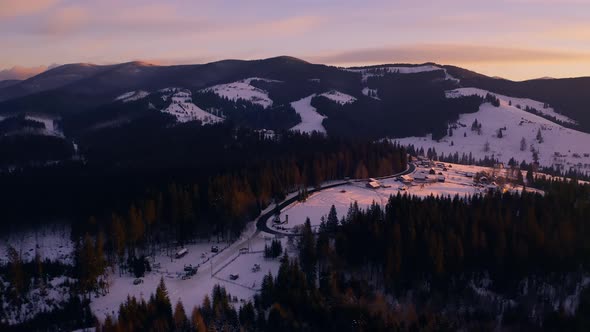 Beautiful Aerial  Shot of Snowy Mountains During Sunrise