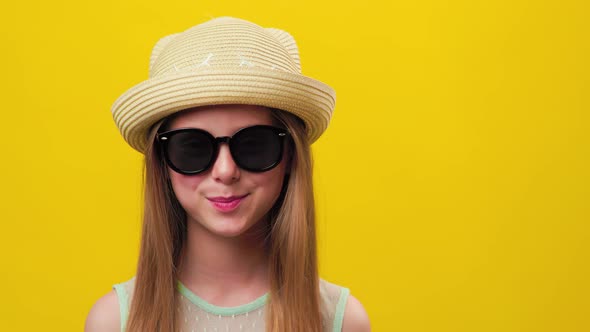 Stylish Happy Fun Child Blond Girl with Sunglasses and Hat