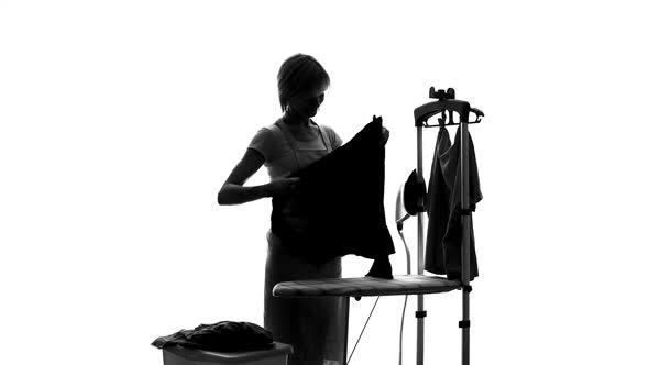 Laundry Service Worker Ironing Customers Clothes, Hotel Dry Cleaning, Housewife