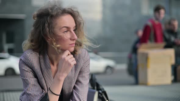 pensive young woman. Office worker reflects and worries about the future