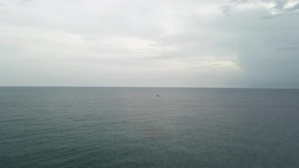 Lonely Sailboat In The Pacific Ocean